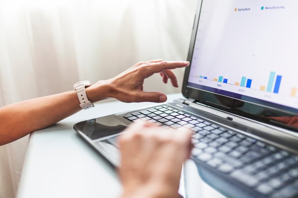 crop-hands-using-laptop-office